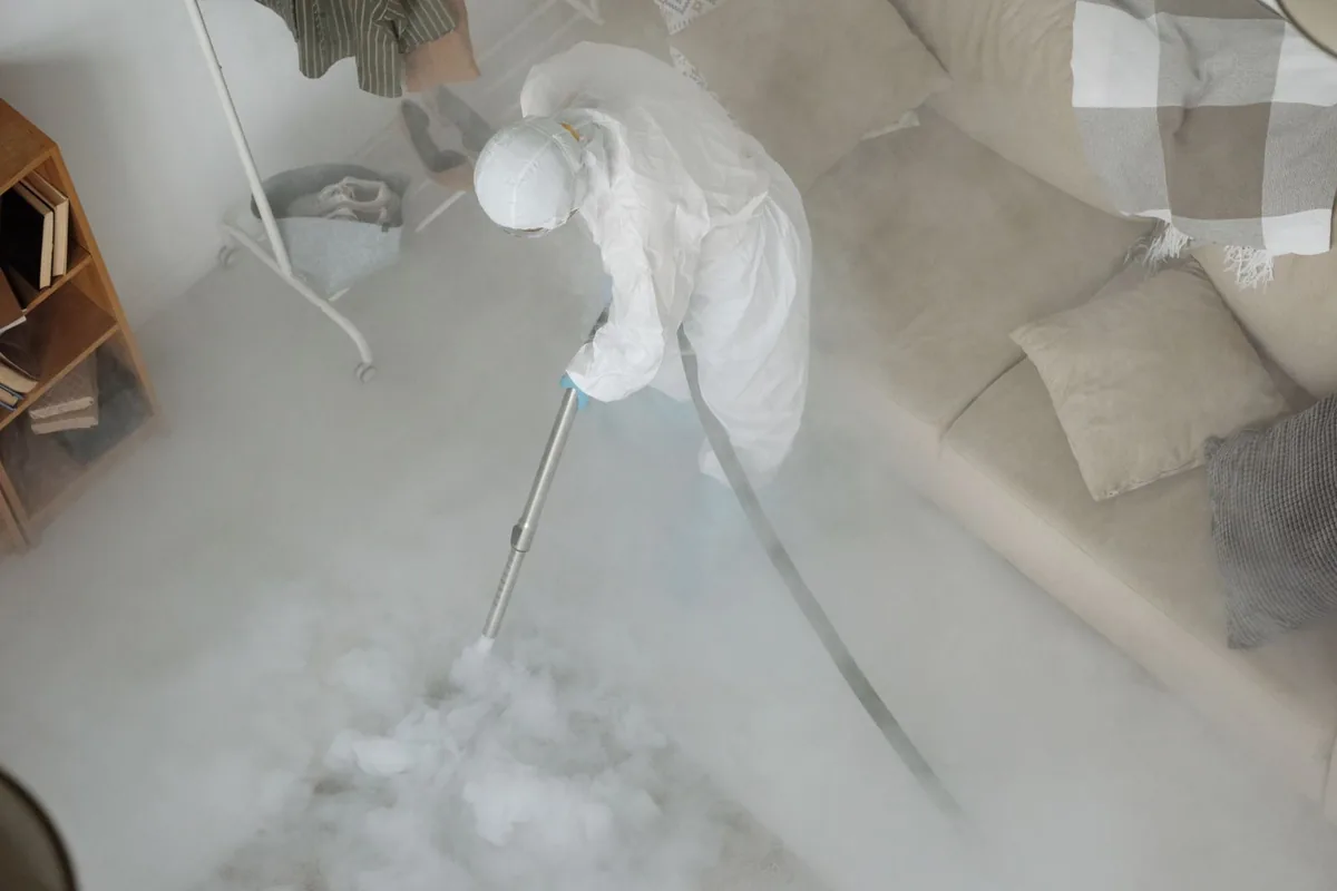 Biohazard cleanup technician in protective equipment, North Browning, MT